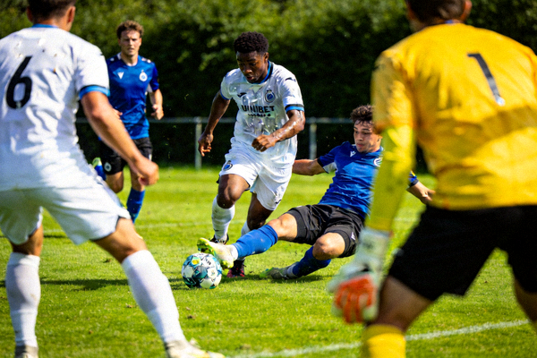 Football match with players competing on the field