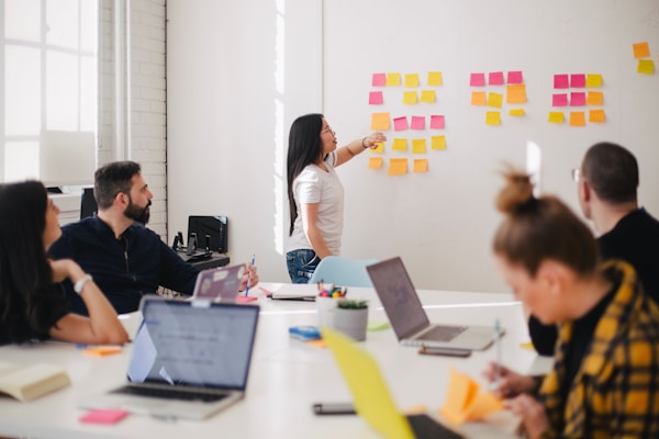 Team of analysts collaborating over sports data in a modern office